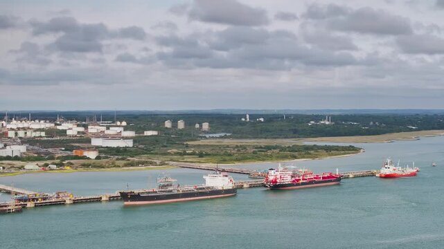 Gas tankers over refinery Esso Oil Terminal from drone, Southampton, Hampshire, England, Europe