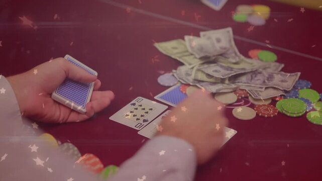Animation of star icons falling over mid section of male croupier distributing cards at casino table