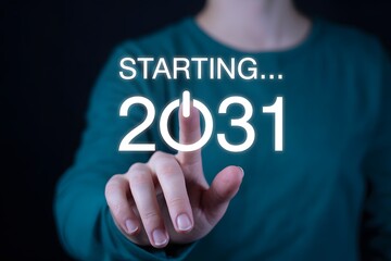 A person in green shirt touching the screen with starting and year twenty thirty one on it glowingly