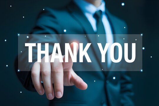 Man in suit touching a thank you message on a screen with a dark blue background and bokeh effect