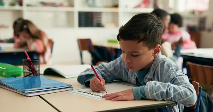 Education, writing and kid in classroom at school for test, assessment or project for learning. Color pencil, student and boy child with notebook for drawing with creative assignment at campus.
