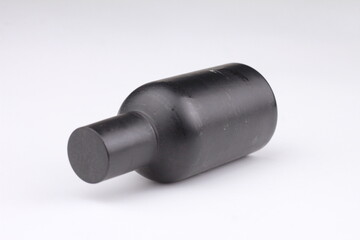 Close-up of perfume bottle isolated on white background.