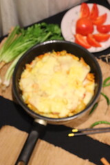 Double cheese pineapple pizza served in a hot pan, rich, cheesy, and delicious with a tropical twist.