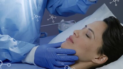 Animation of molecules over caucasian male doctor with patient - Powered by Adobe