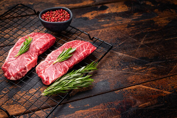 Raw Top blade steak, marbled black angus prime beef. wooden background. top view