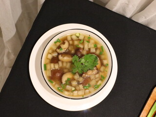 Clear soup with shiitake mushrooms and daikon radish, a light and healthy Asian dish with a...