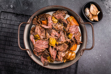 Braised Beef Cheek Stew, traditional Slow cooked meat. black background. top view
