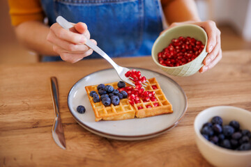 Woman having breakfast at home