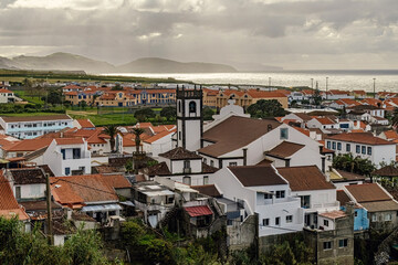 Fototapeta premium Coastal town with small houses in San Miguel island Azores, Portugal