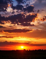 Fototapeta premium Dramatic sunset over fields