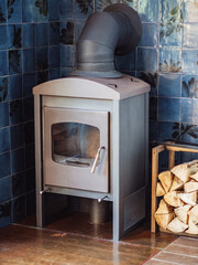 Grey fireplace with firewood rack indoors