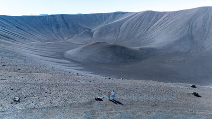 Exploring the vast caldera of Hverfjall Volcano in Iceland with stunning geological formations