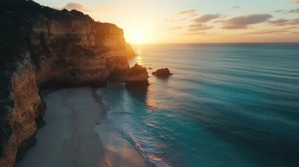 Coastal sunrise, dramatic cliffs, sandy beach, tranquil ocean. Aerial view. Suitable for travel, nature, and wallpaper