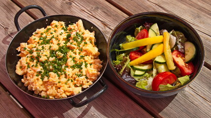 Spaetzle with cheese and vegetable salad in a restaurant in Austria, Europe
