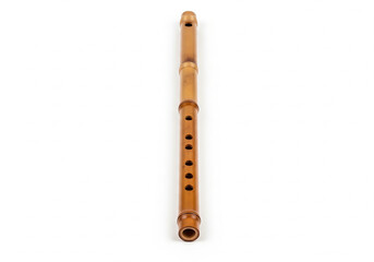 A traditional Asian bamboo flute, an ancient woodwind musical instrument for folk melodies and cultural performances, isolated on a white background