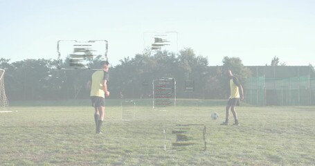 soccer players warming up on pitch for training, ball push initiating passing overlays - Powered by Adobe