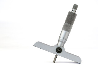 Depth micrometer on a white background. The silver and metallic gray precision measuring tool is shown at an angle, highlighting its scale and design.