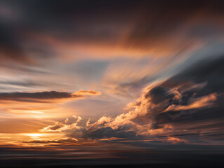 Fototapeta premium Dramatic Cloudscape with Golden Sunlight during Sunset or Sunrise