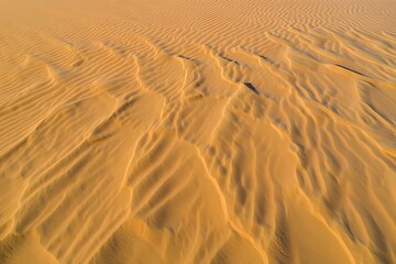 Fototapeta premium Golden Desert Sand Dunes Aerial Texture Background