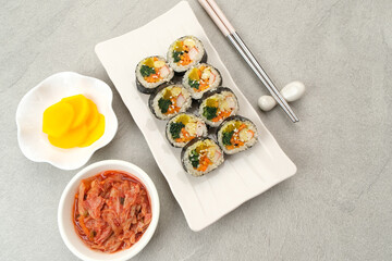 Korean Rolled Gimbap, served with kimchi and danmuji. Korean food