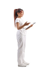 Fototapeta premium Beautician in a white uniform talking