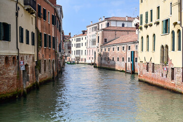 Gorgeous cityscape of Venice with narrow canals, boats and gondolas and bridges with traditional Colorful  buildings. Location: Venice, Veneto region, Italy, Europe
