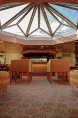 Cozy living room atmosphere inside cafe café coffee shop bar lounge bistro onboard luxury cruiseship cruise ship liner old fashioned classic interior design