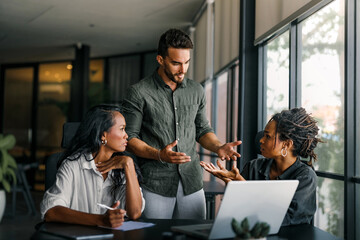 Colleagues arguing at workplace, executives disagree about papers, found error in contract