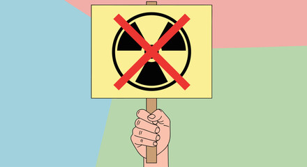 Hand holding a protest sign against nuclear energy.