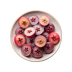 Overhead view of sliced Star Apples on a white plate against white background