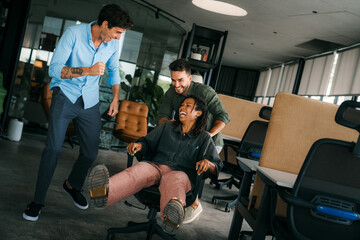 Portrait of overjoyed young diverse employees workers in creative modern office. Team building