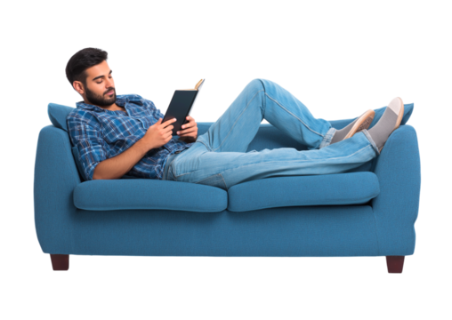Young Man Relaxing on a Blue Sofa, Engaged in Reading a Book Comfortably isolated on a transparent background