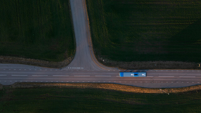 Directly above shot of bus on road amidst agricultural field