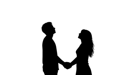 Silhouetted couple holding hands looking upwards together against a bright white background