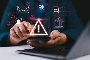 Cybersecurity warning on mobile phone showing alert messages and phishing scams targeting email, bank, and personal data. Online safety and data protection while using smartphone and laptop at home.