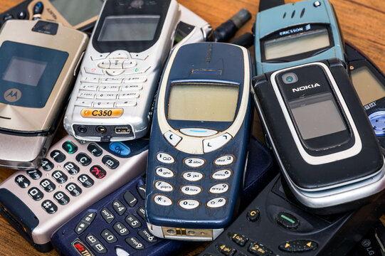 Stack of vintage mobile phones showing technological evolution