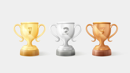 Set of gold, silver and bronze trophies with number symbolizing first, second and third place award