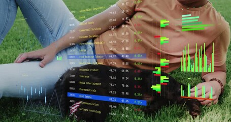 Man lying on lawn petting puppy after sniffing hand while financial overlay cycling sector data - Powered by Adobe