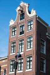 Beautiful cityscape view of the city of Amsterdam as seen from the canal and bridges.