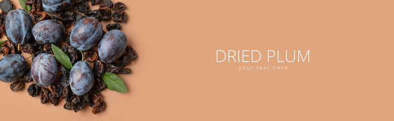 Dried plum prunes and fresh plums with green leaves on brown background flat lay top view. Food background, dried delicious fruits, sweet healthy dessert, healthy eating. Long banner