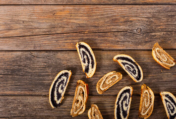 poppy and walnut roll cakes, old wood table, christmas and easter traditional east european dessert