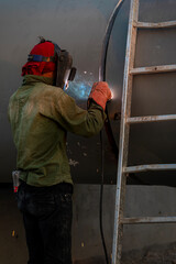 He is a welder in compress gas station .