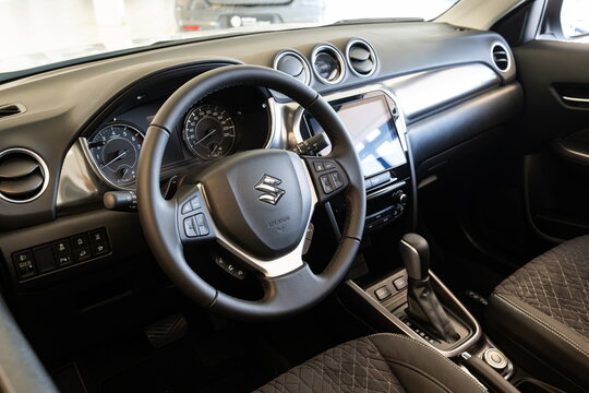 Safenwil, Switzerland, August 16, 2025. New Suzuki Vitara compact SUV interior view. Emil Frey open days showroom floor, wide angle view, window light