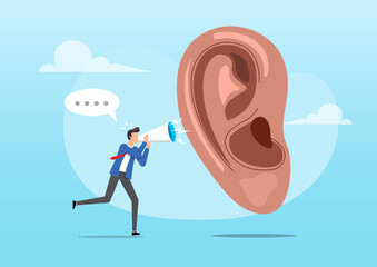 A businessman holding a megaphone and shouting