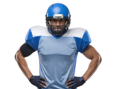 A football player in a blue uniform stands confidently, wearing a helmet and protective gear, ready for action. - Powered by Adobe
