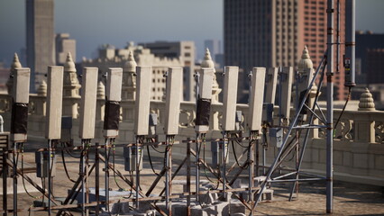 Row of Electrical Wires on Rooftop Conveys Urban Landscape in Metropolis © icetray