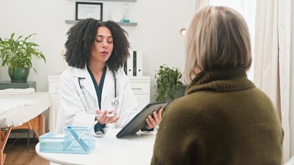 Professional Diverse Doctor Provides Medical Advice During a Consultative Session with a Patient - Powered by Adobe