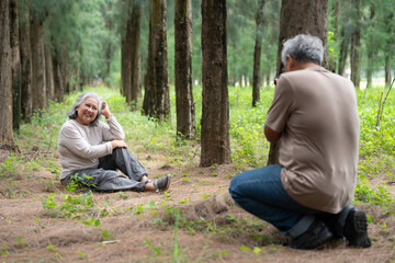 A senior couple enjoys retirement together, exploring the outside world with a joyful spirit. Their romantic bond and caring relationship grow stronger with age, embracing travel and shared memories.