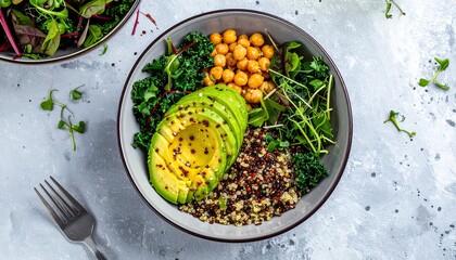 Colorful vegan bowl with quinoa, avocado, chickpeas, and fresh greens on minimalist white kitchen background, healthy plant based meal, modern clean food photography