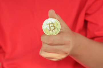 Cryptocurrency concept. Bitcoin in hand. Digital currency in hand.